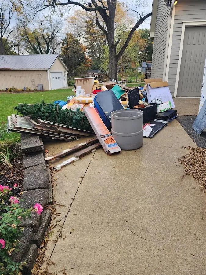 Dumpster being loaded with debris for 30 Yard Dumpster Rental in Whitfield